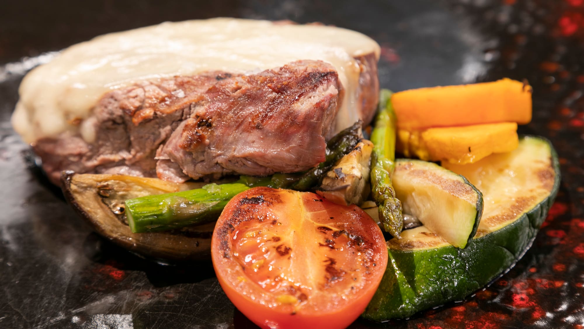 a plate of food with meat and vegetables