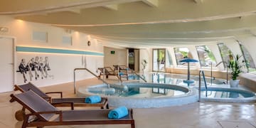 a pool with chairs and a towel on it