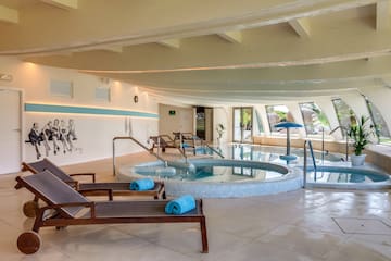 a pool with chairs and a towel on it