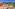 Luxury resort rooftop terrace, ocean view, golf course, palm trees.
