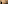 Woman in brown activewear taking mirror selfie in gym with punching bag.