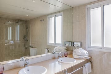 a bathroom with a sink and a shower