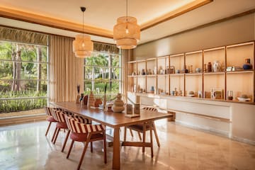 a room with a table and chairs