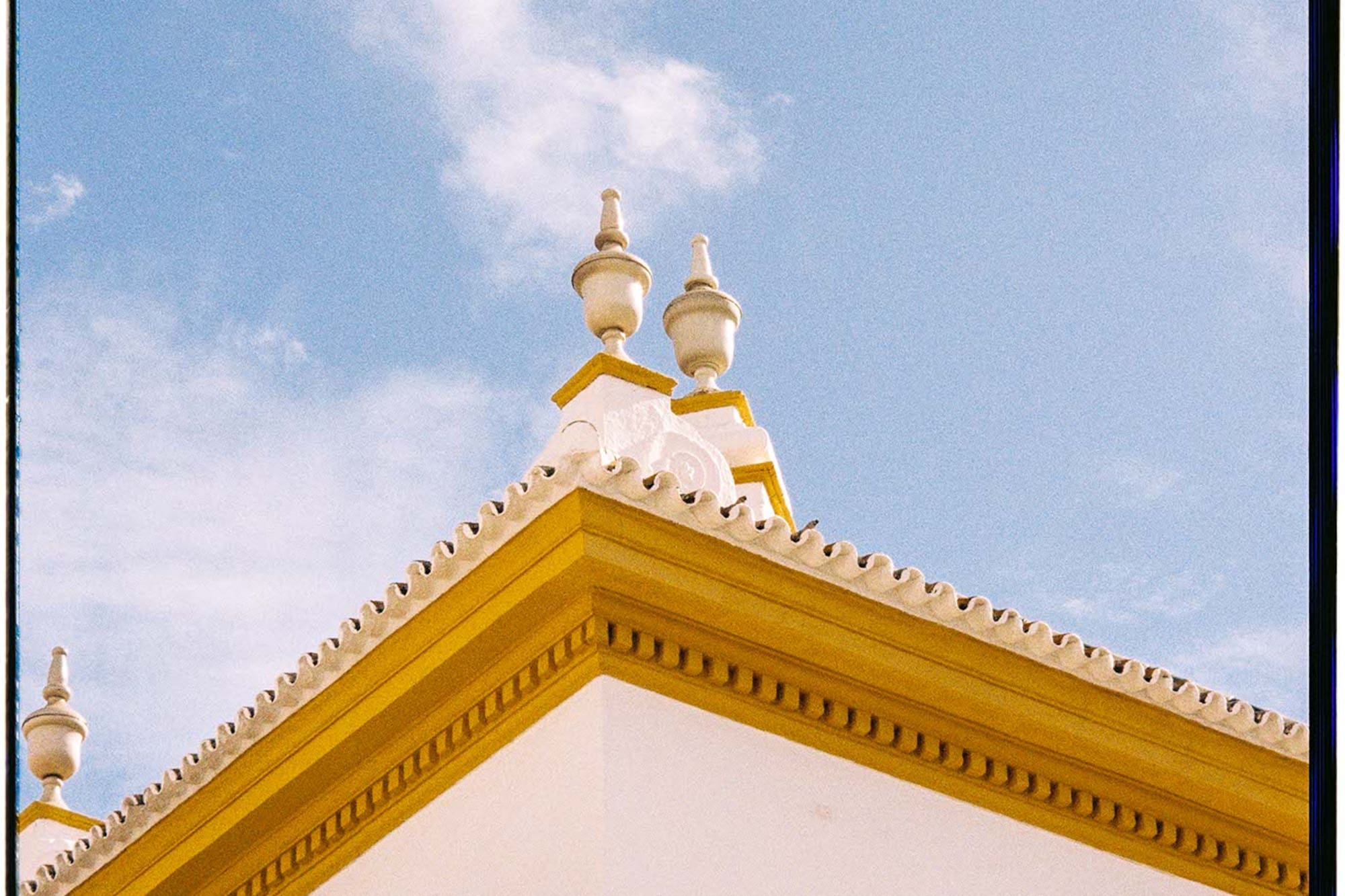 a building with a yellow and white roof