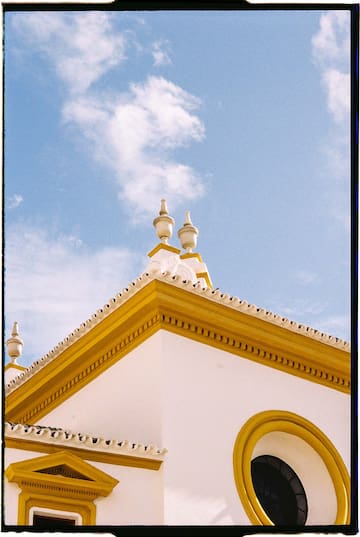 a building with a yellow and white roof