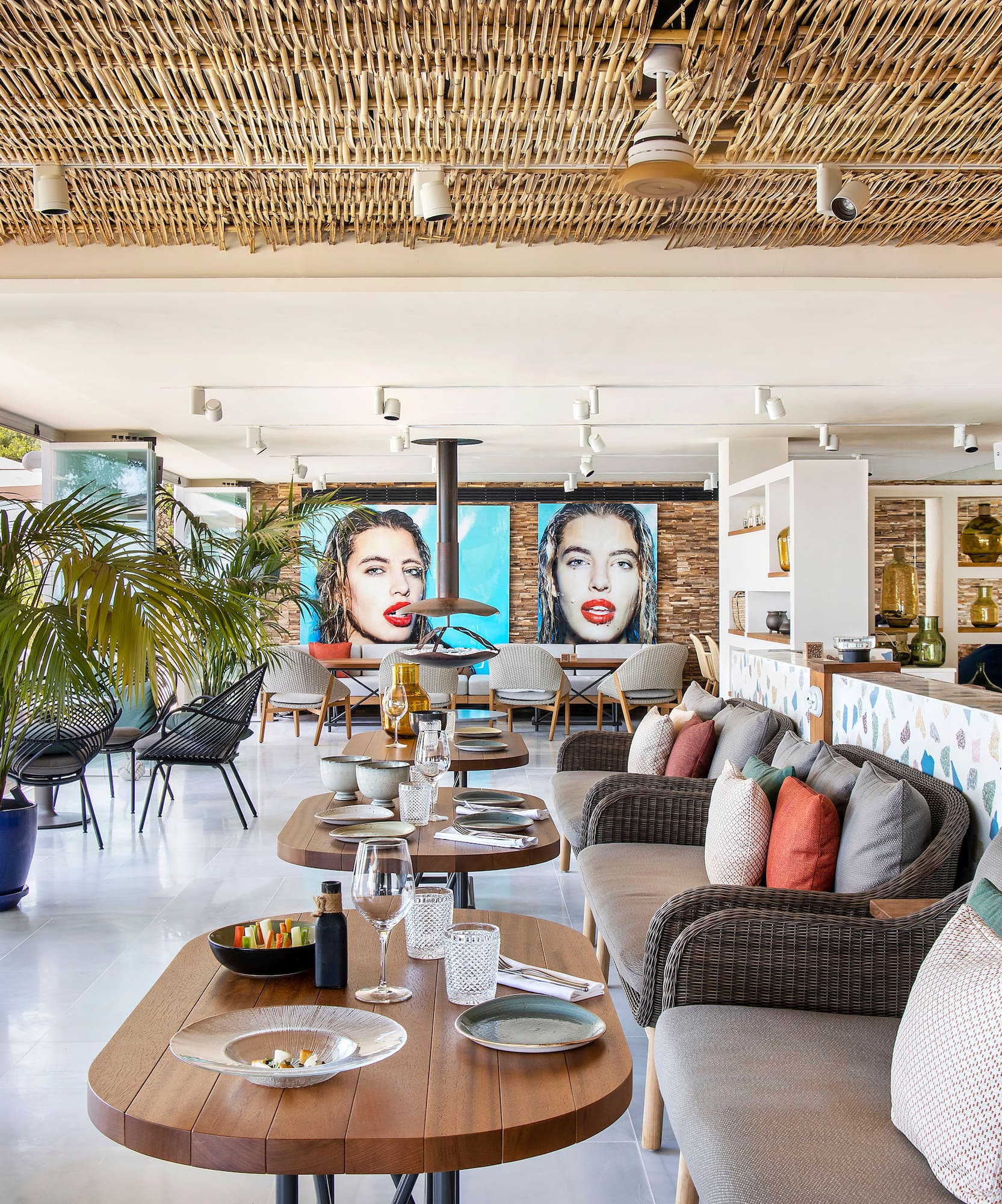 a room with a couch and tables