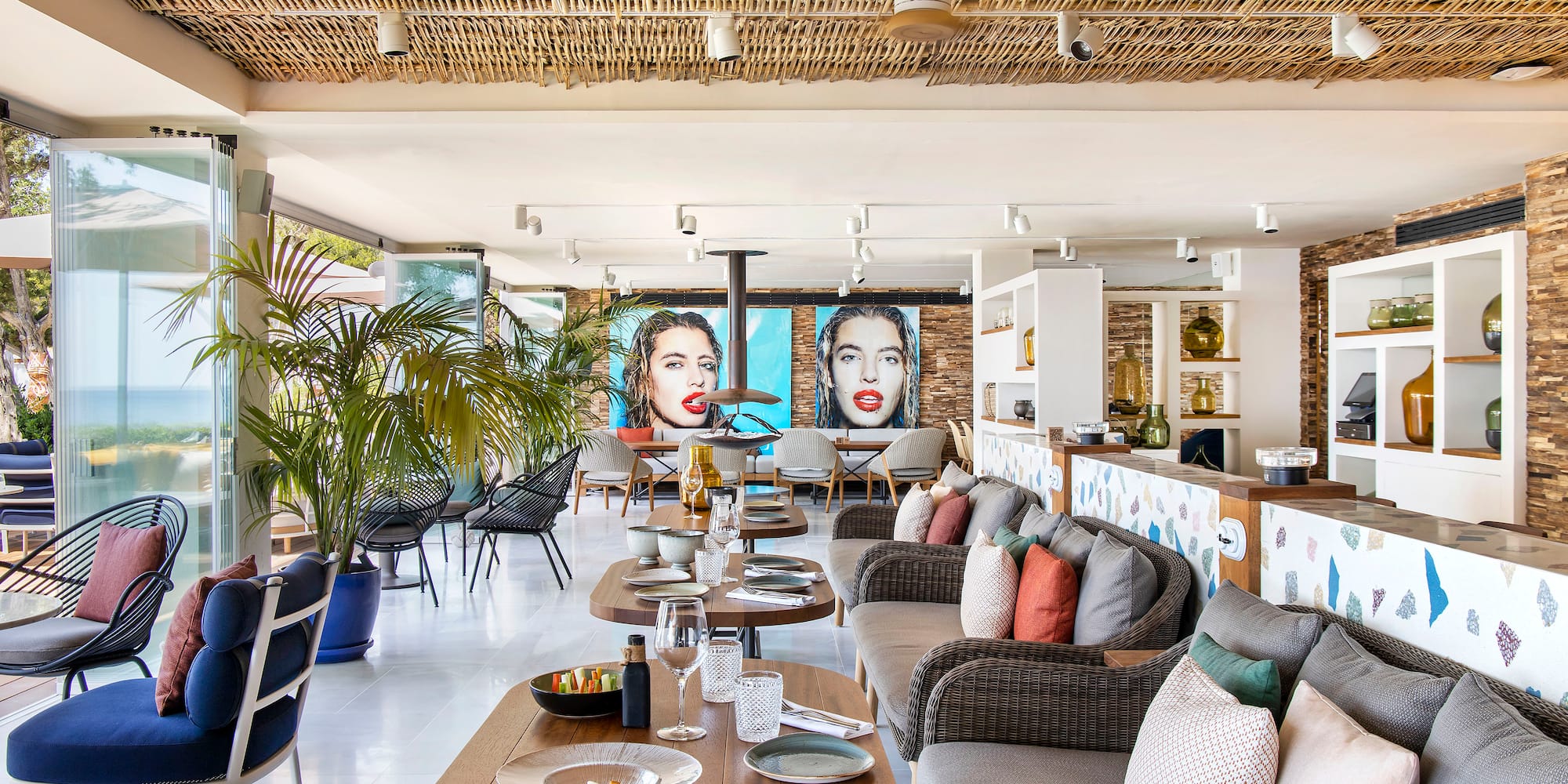 a room with a couch and tables