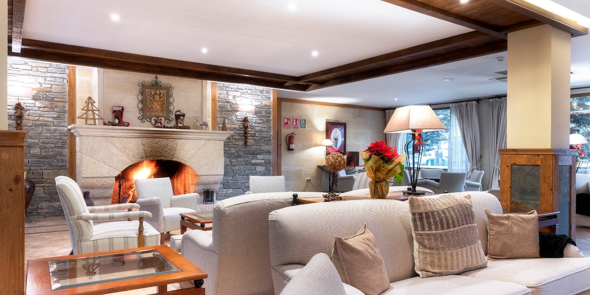 a living room with a fireplace and couches