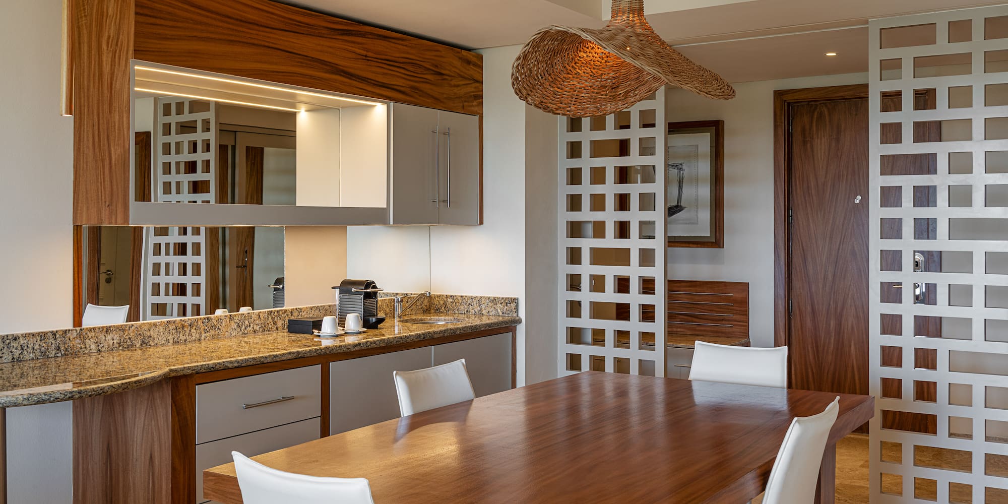 a dining room with a table and chairs