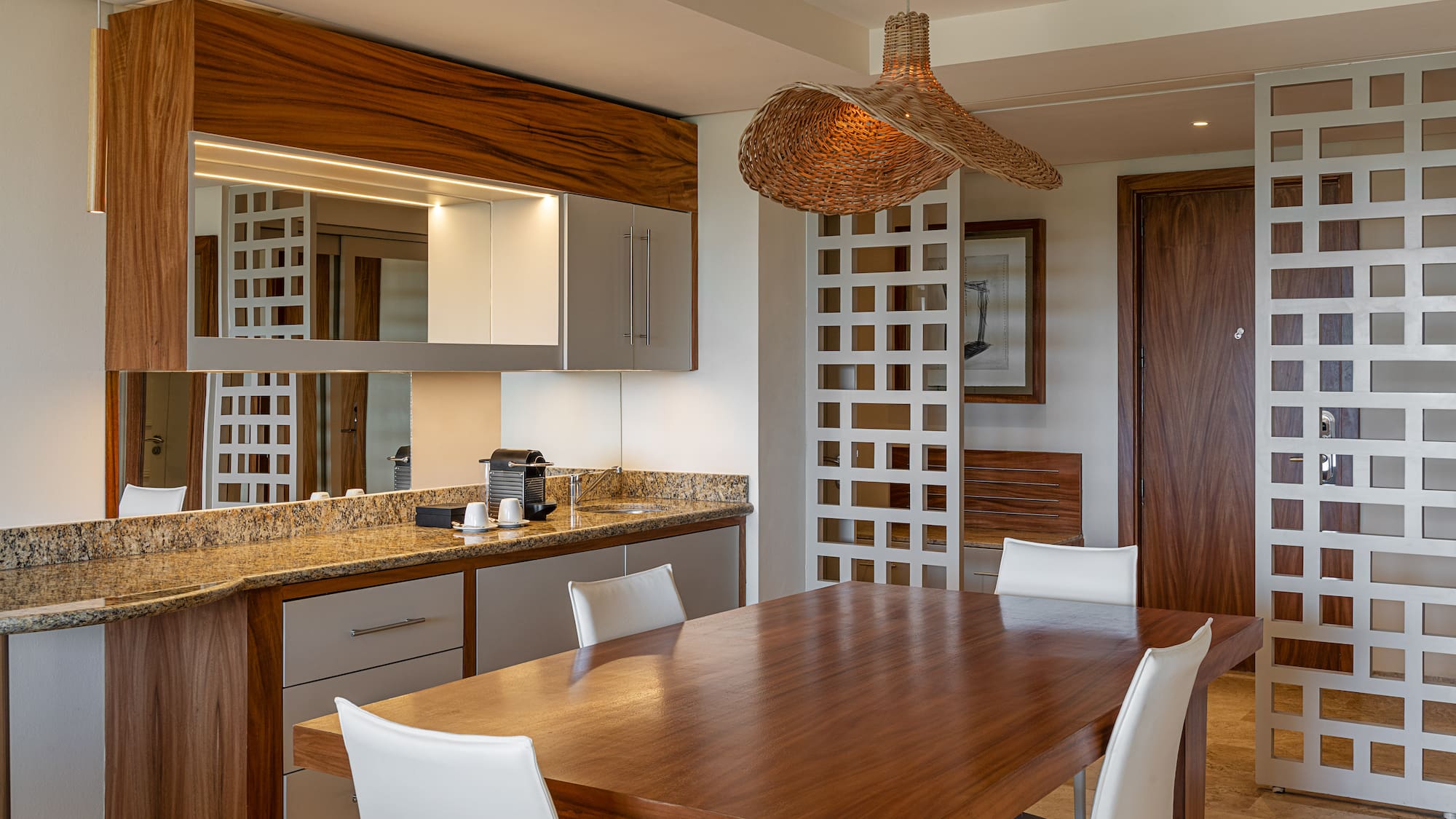 a dining room with a table and chairs
