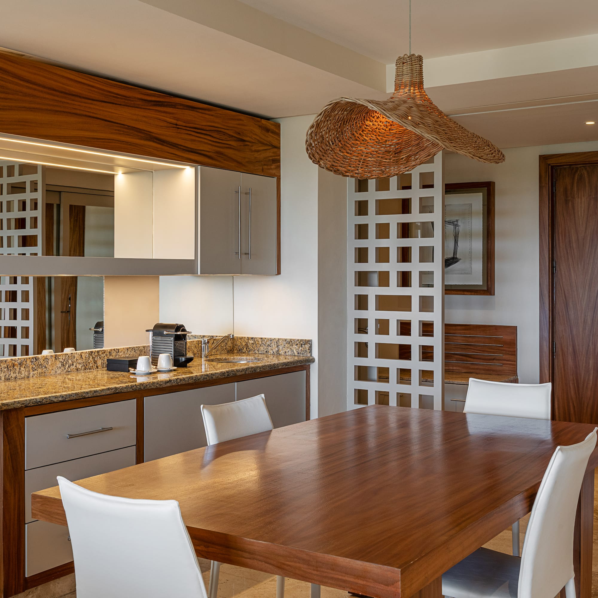 a dining room with a table and chairs