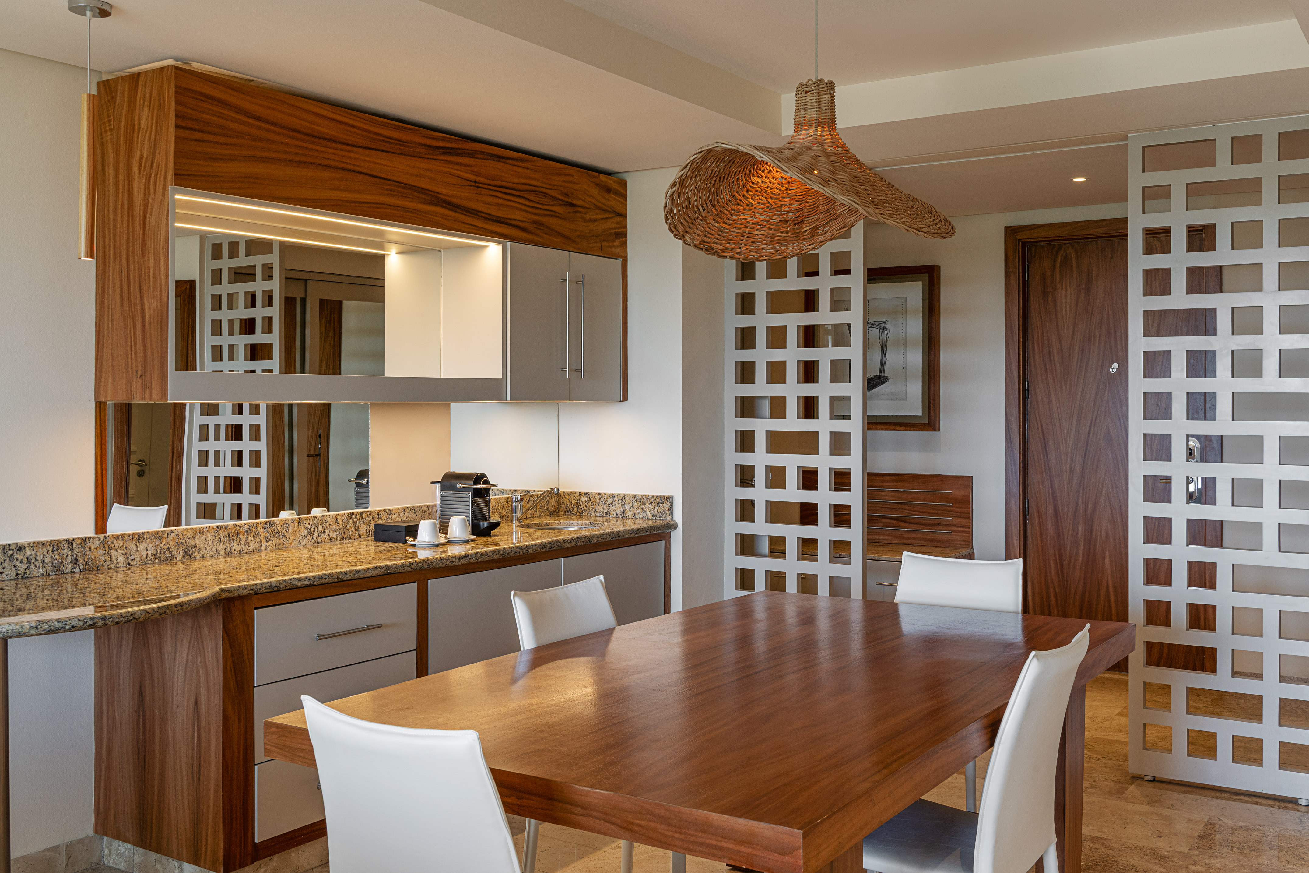 a dining room with a table and chairs