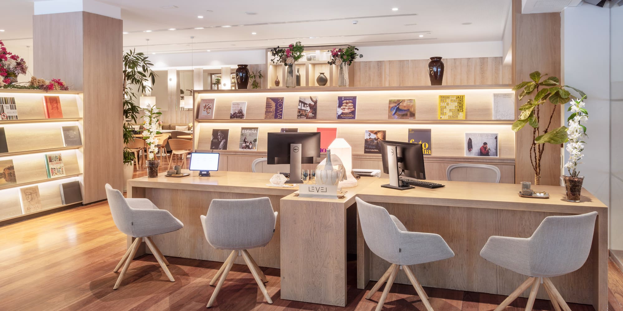 a room with a desk and chairs