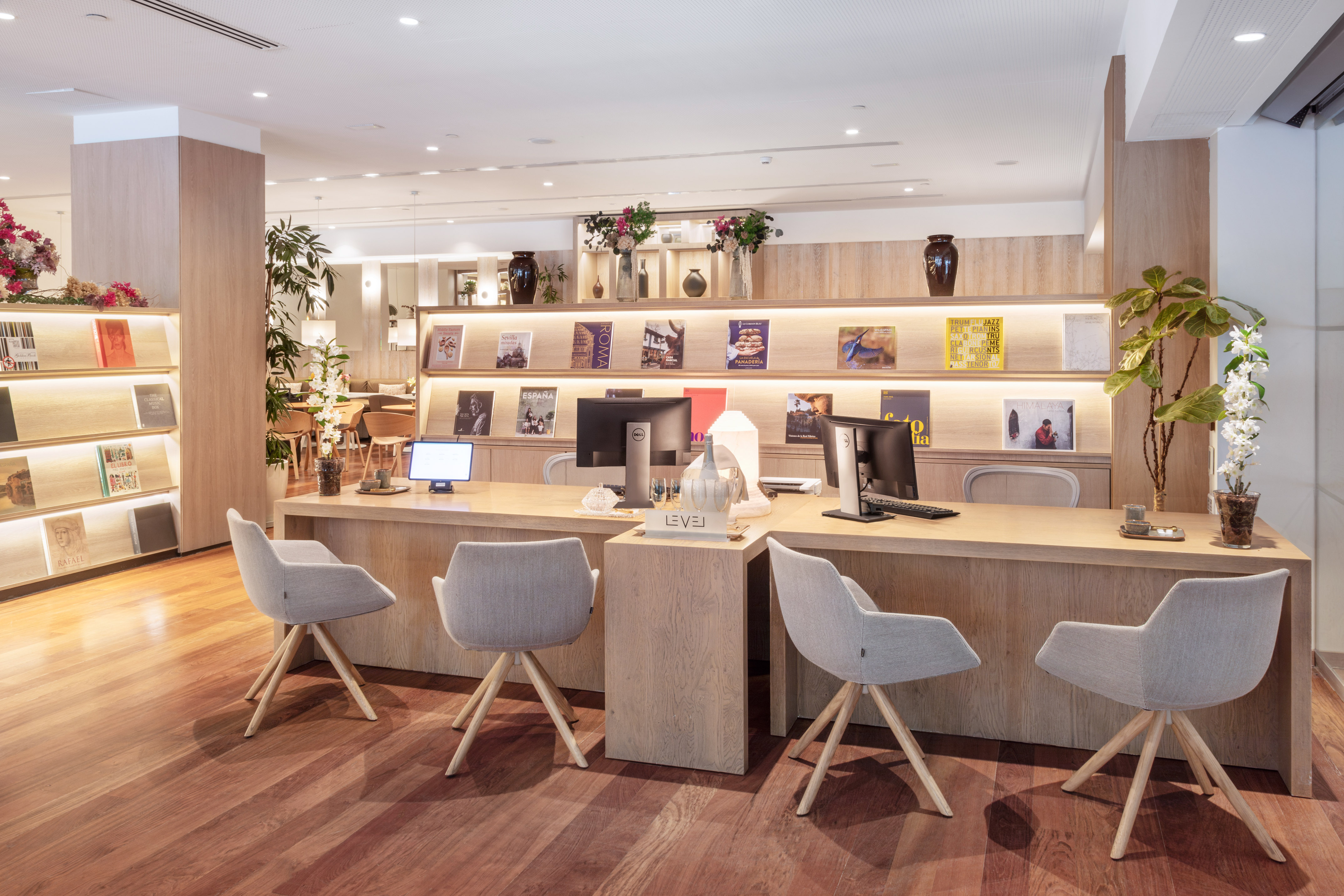 a room with a desk and chairs