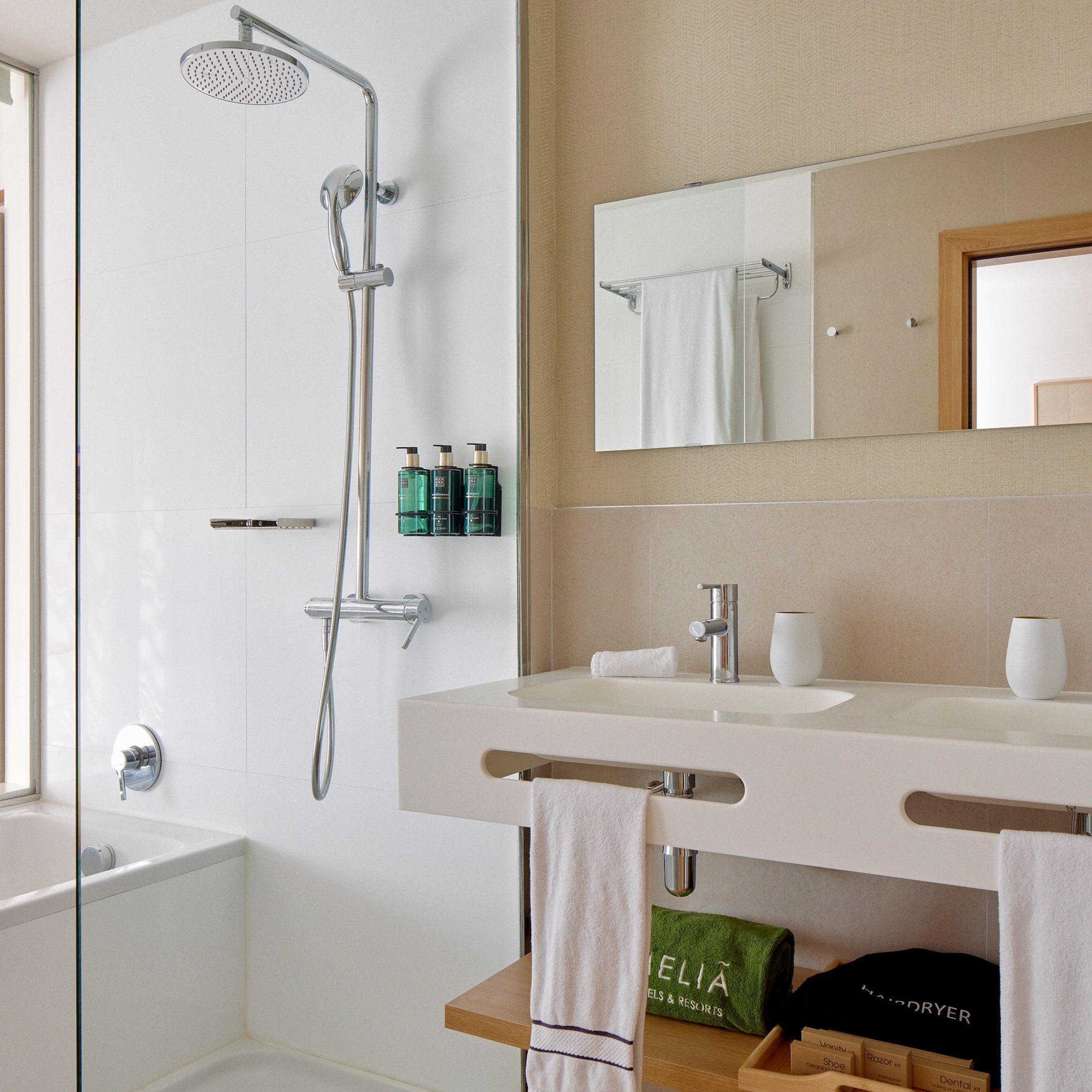 a bathroom with a shower and sink