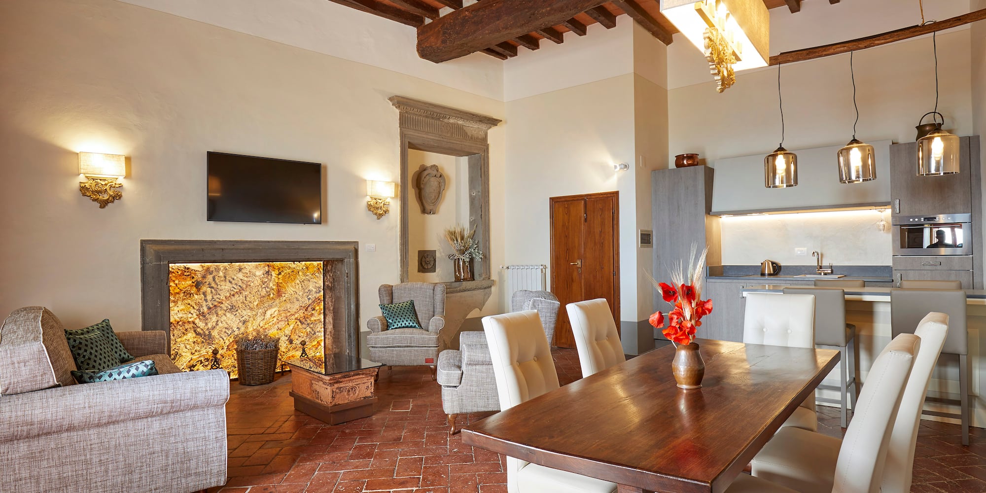 a living room with a table and chairs