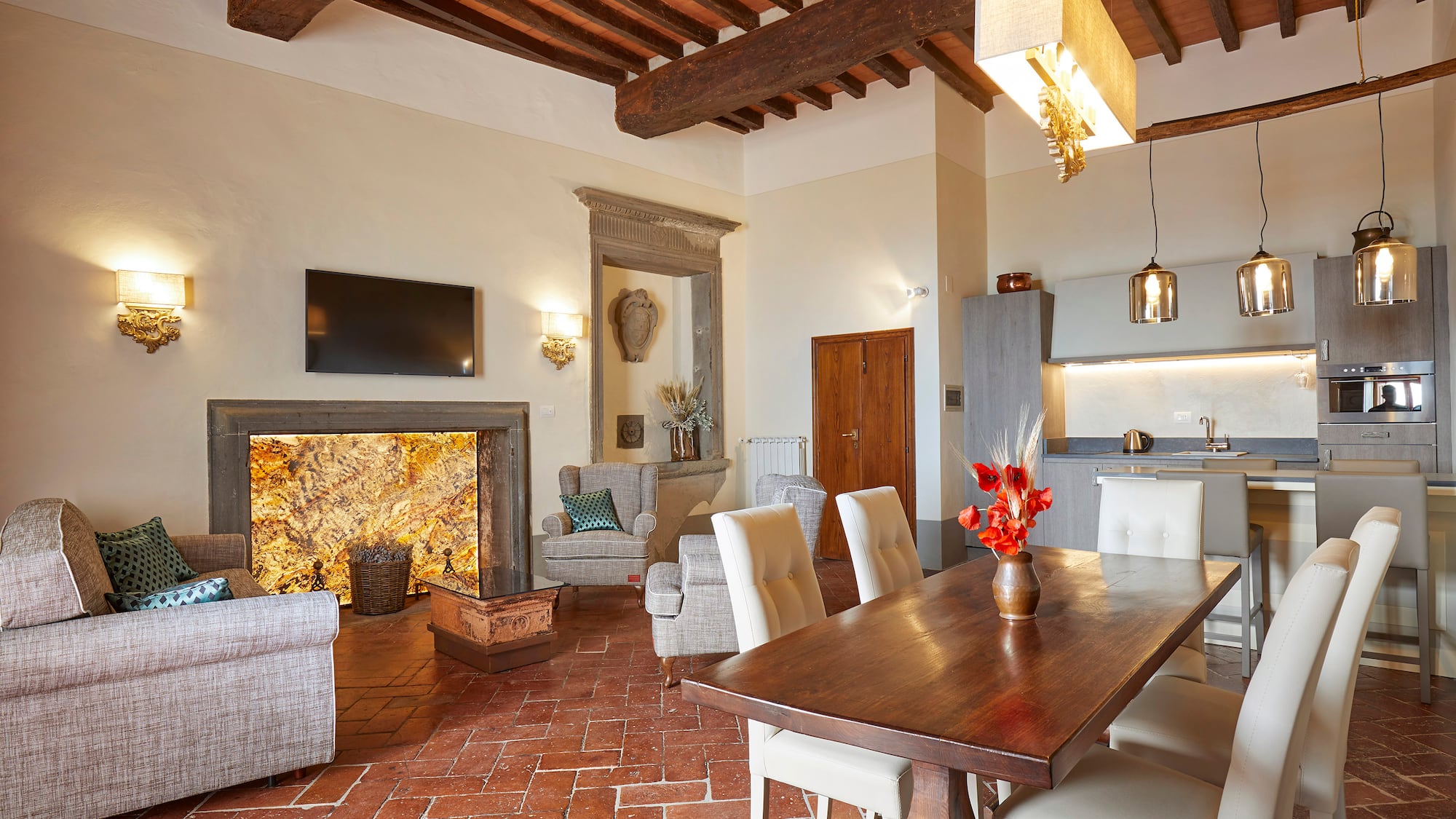 a living room with a table and chairs