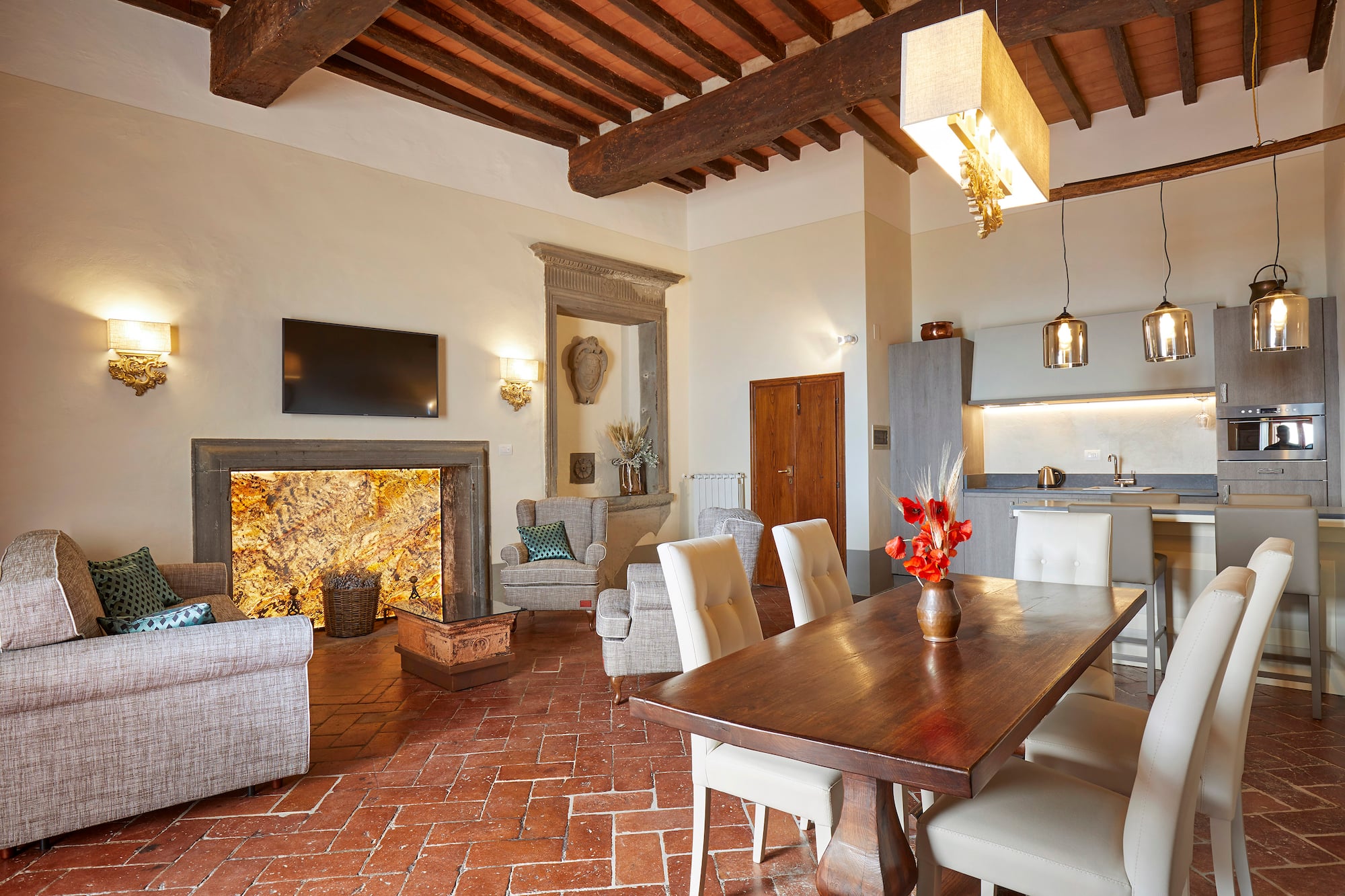 a living room with a table and chairs