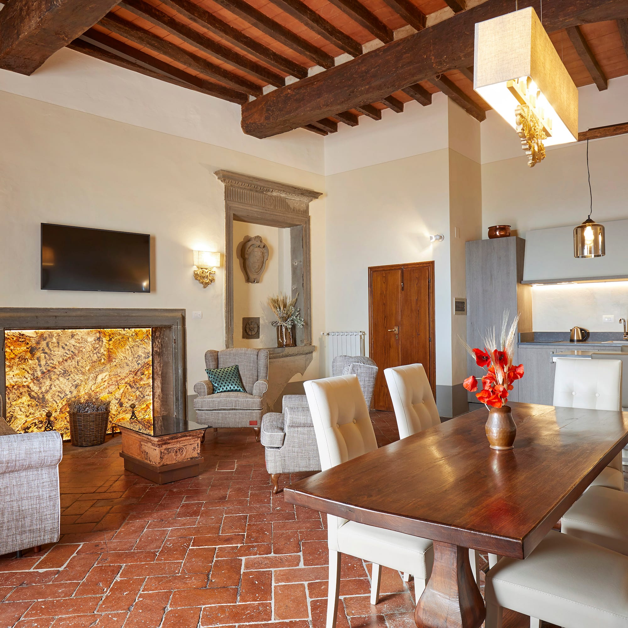a living room with a table and chairs