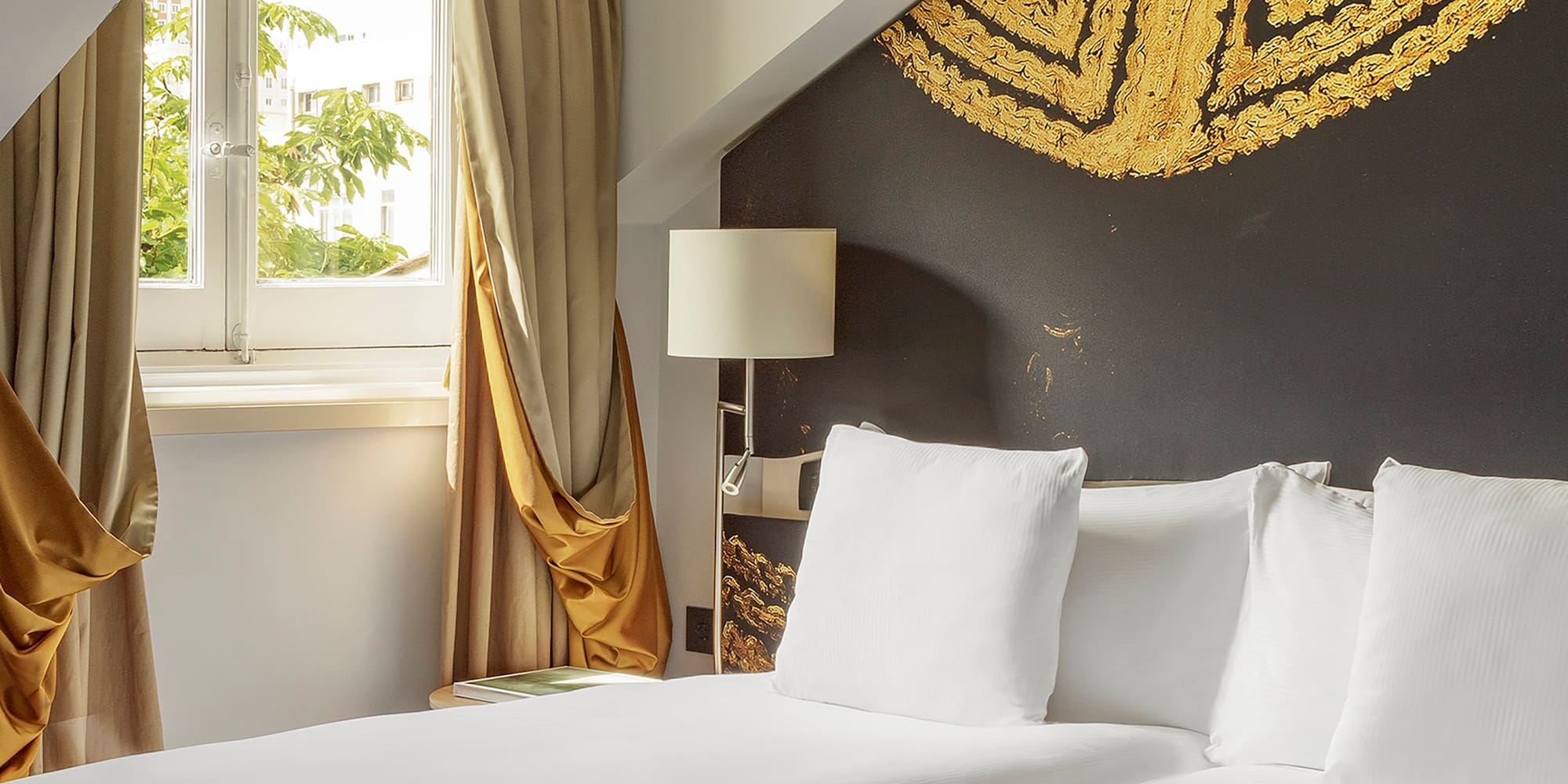 a room with two beds and a window