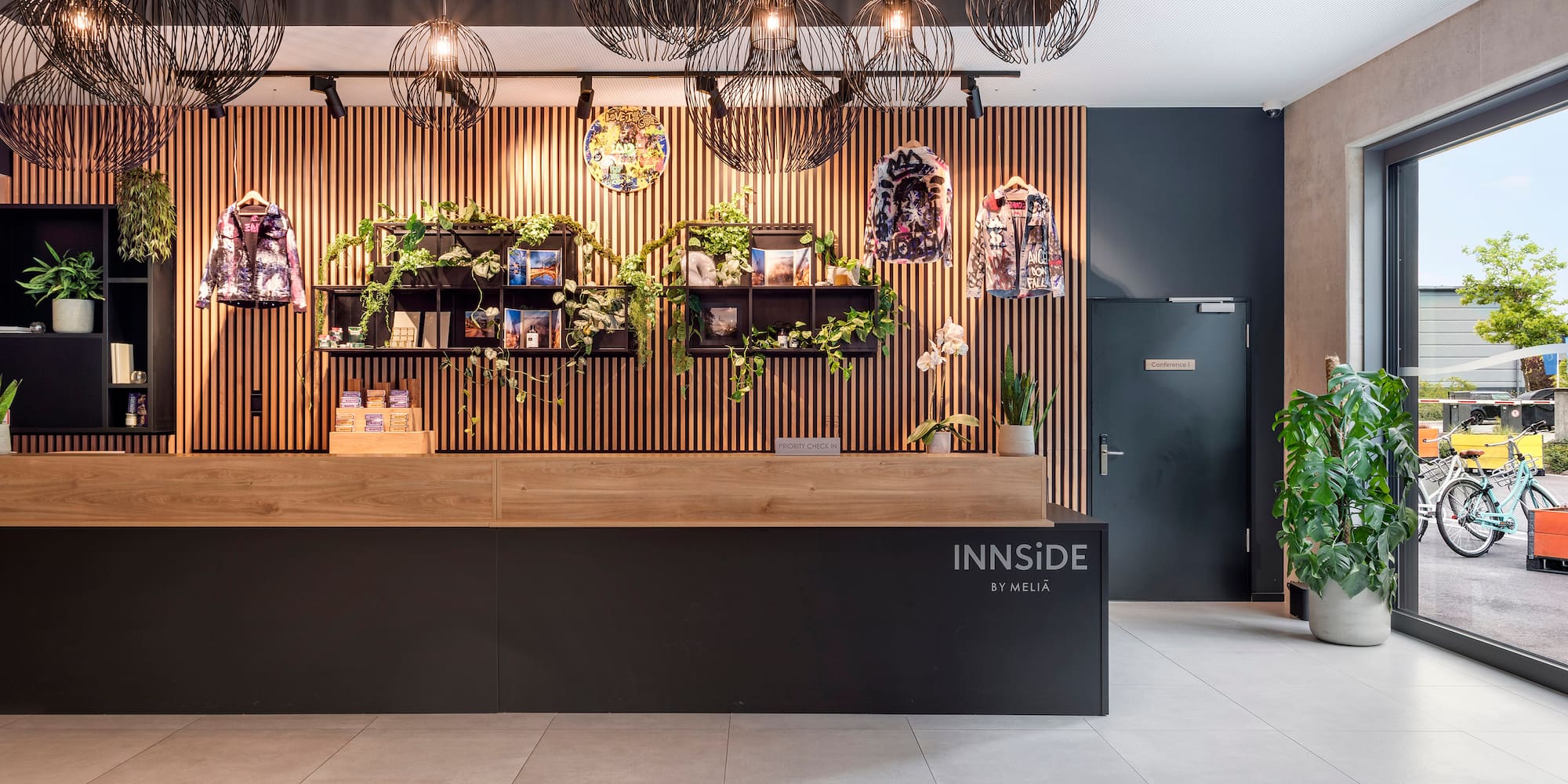 a lobby with a black counter and a black door