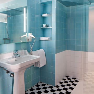 a bathroom with a mirror and a sink
