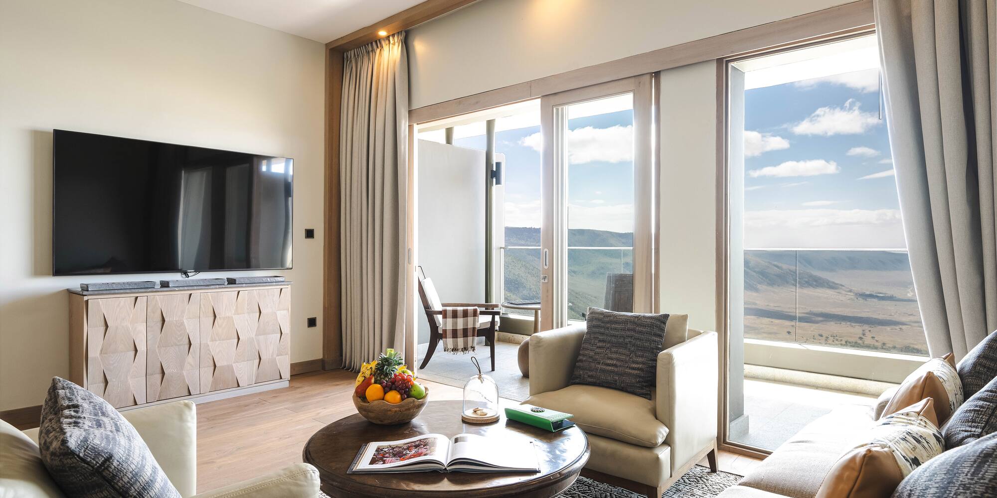 a living room with a television and a table