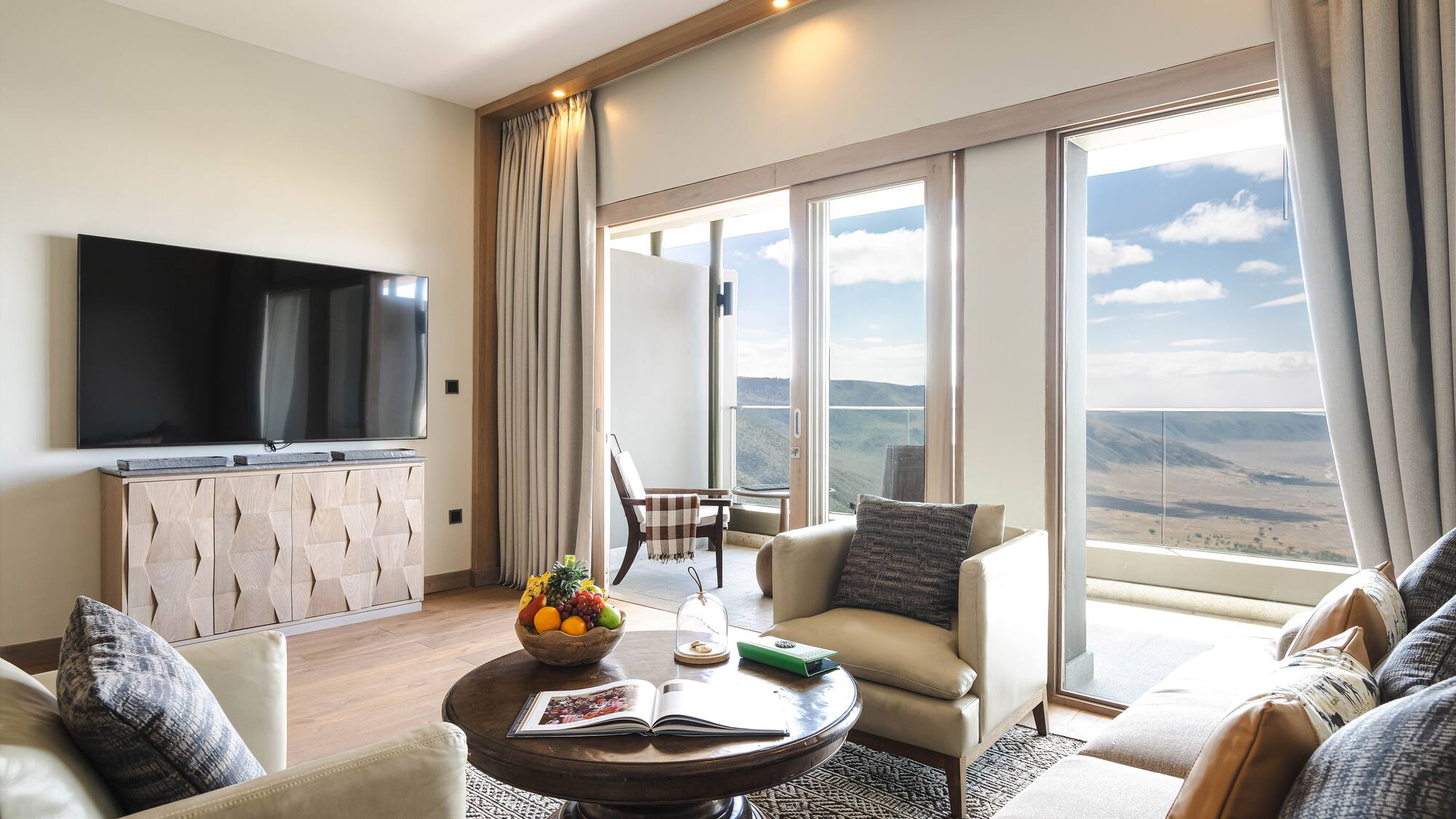 a living room with a television and a table