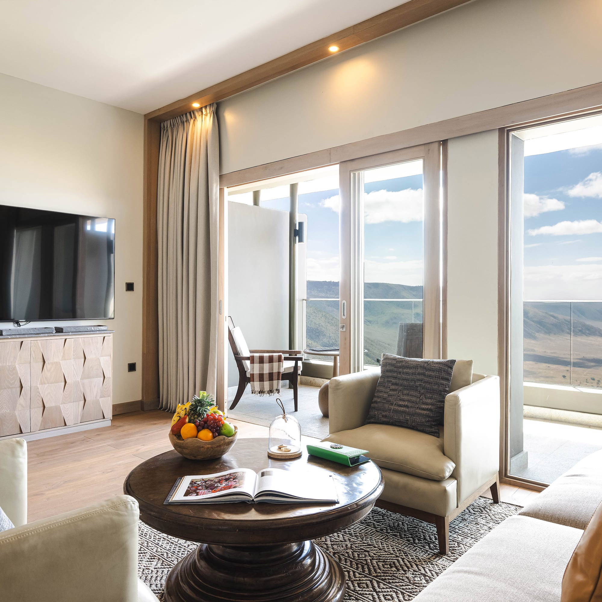 a living room with a television and a table