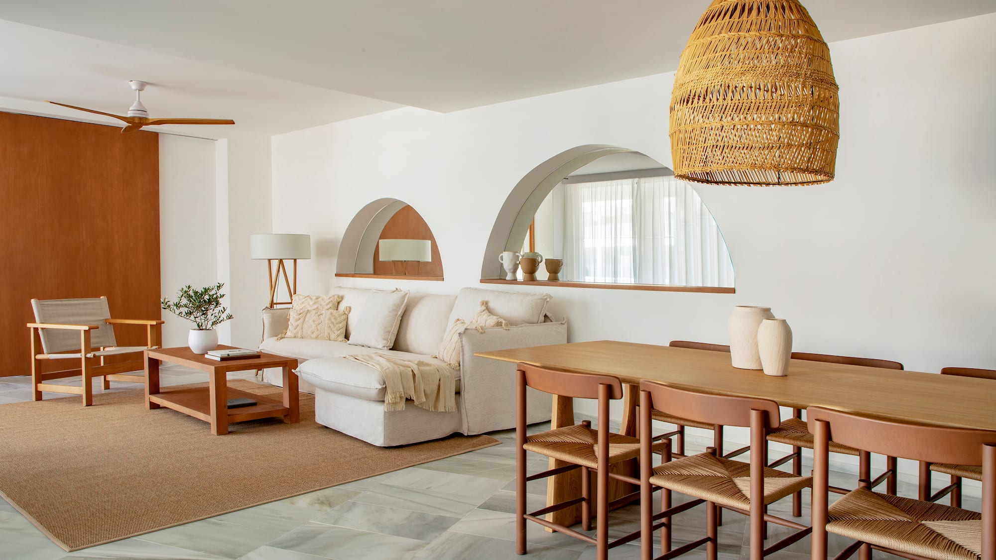 a living room with a table and chairs