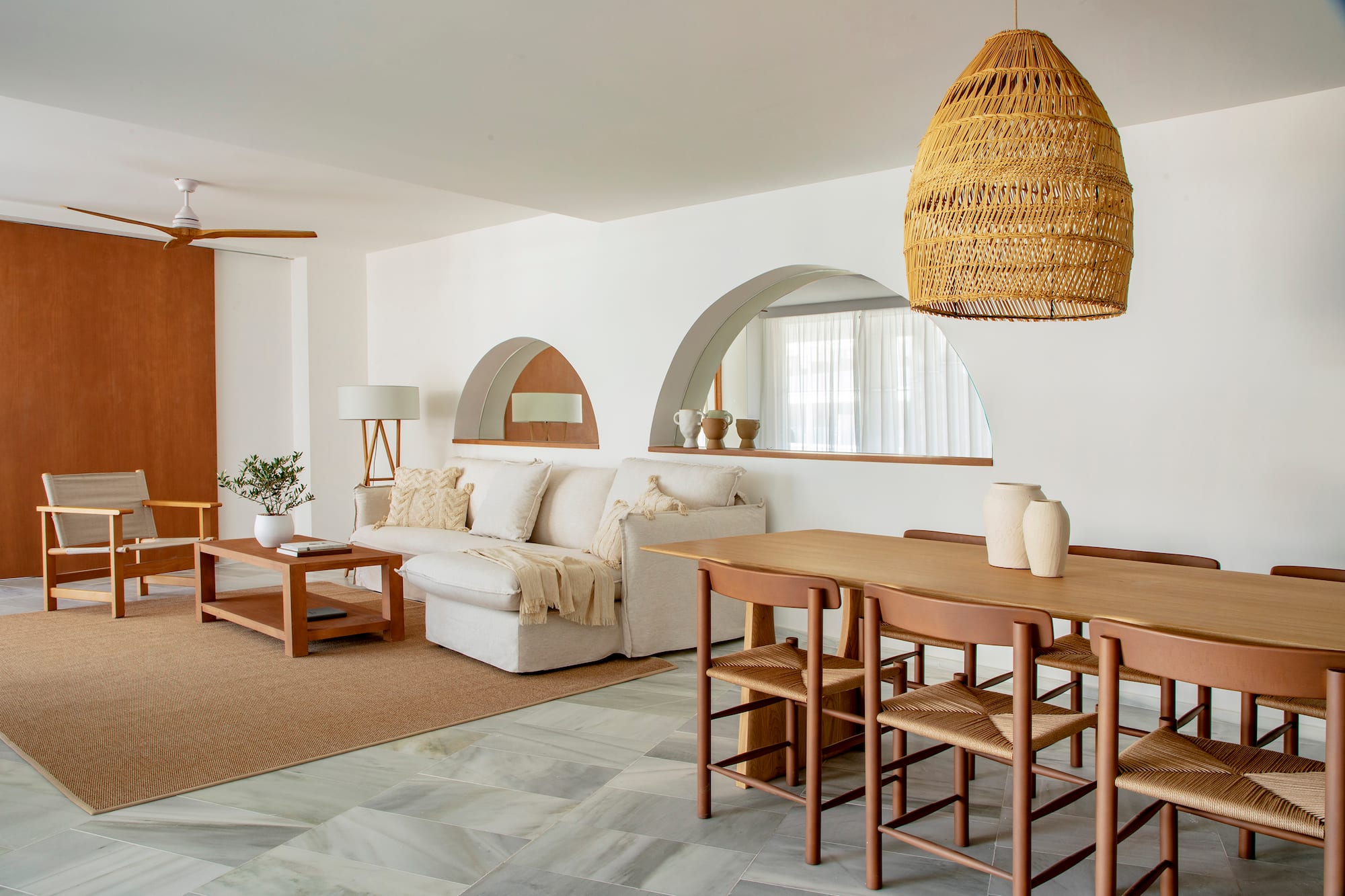 a living room with a table and chairs