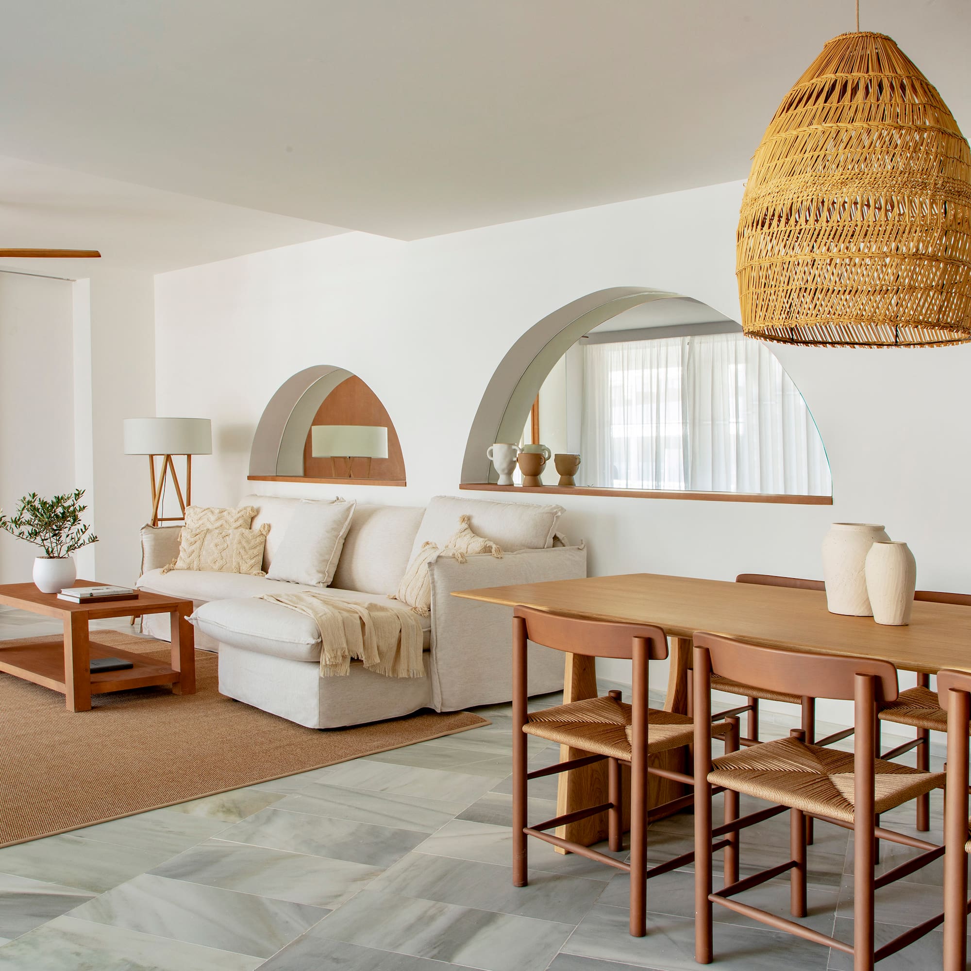 a living room with a table and chairs