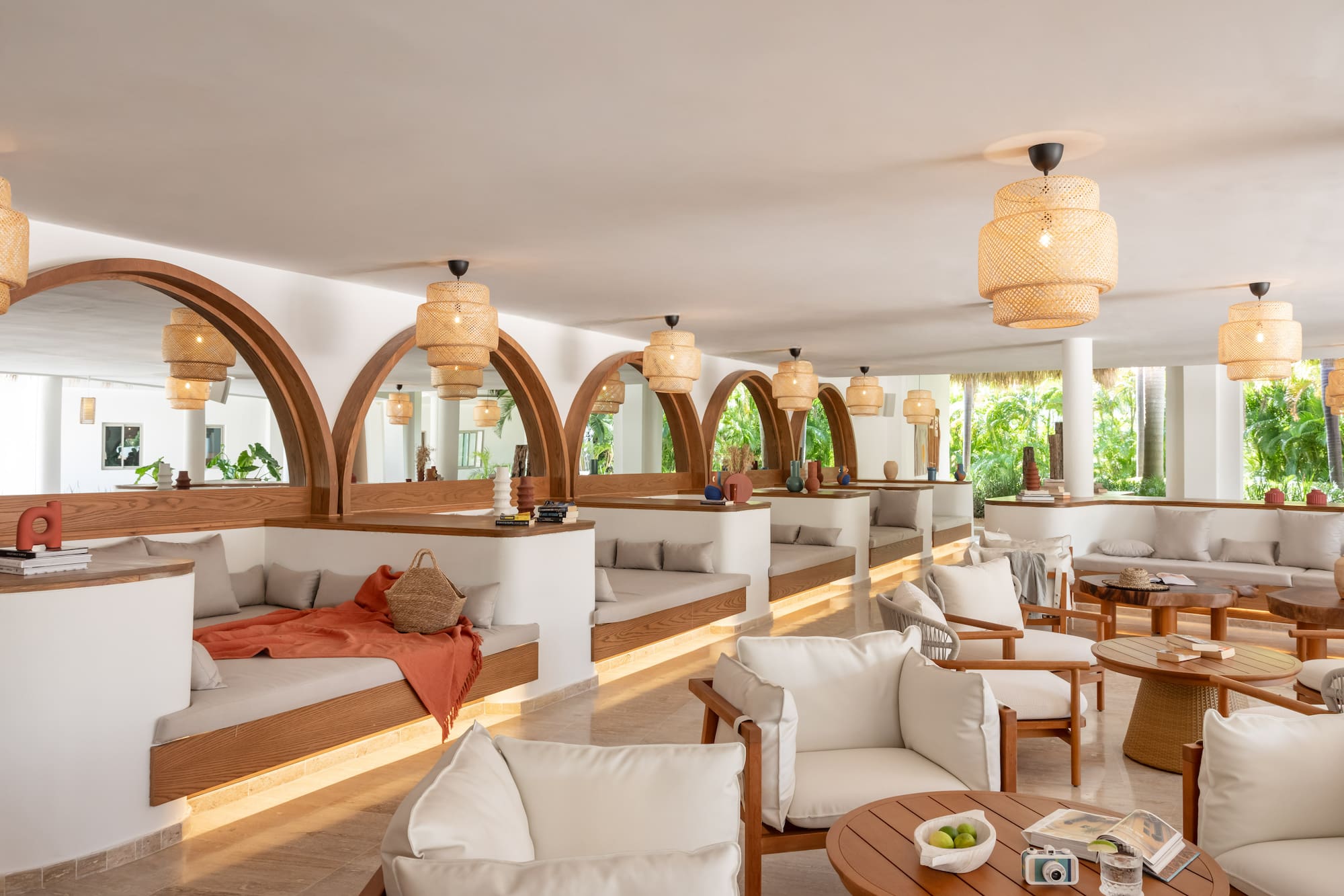 a room with white furniture and tables