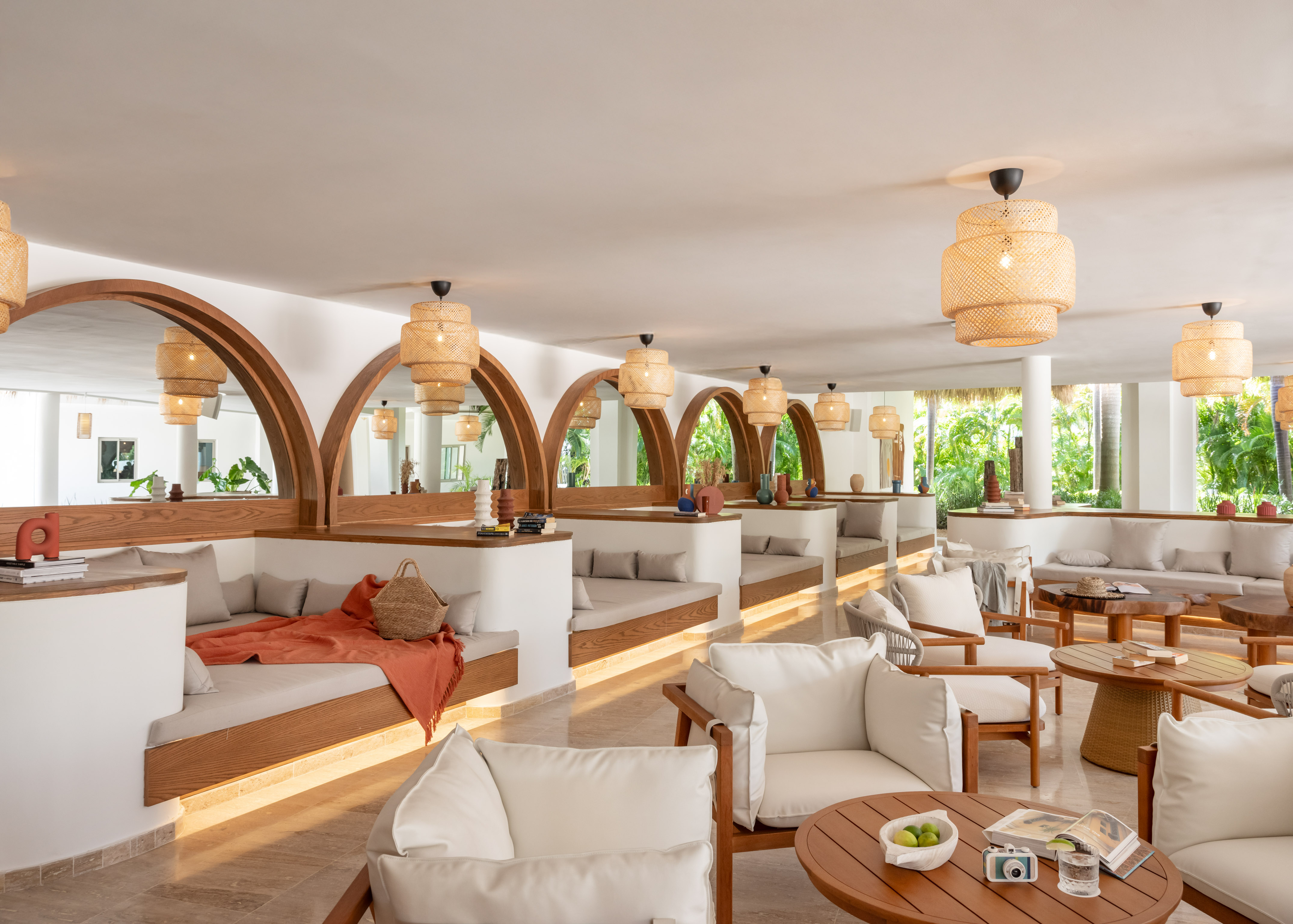 a room with white furniture and tables