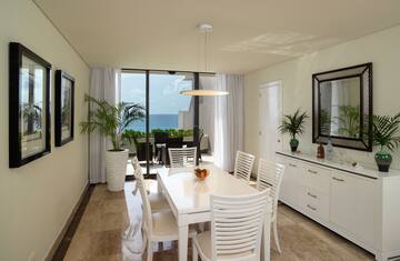 a dining room with a table and chairs