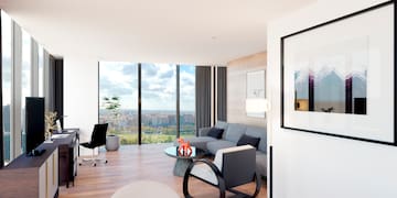 a living room with a large window overlooking a city