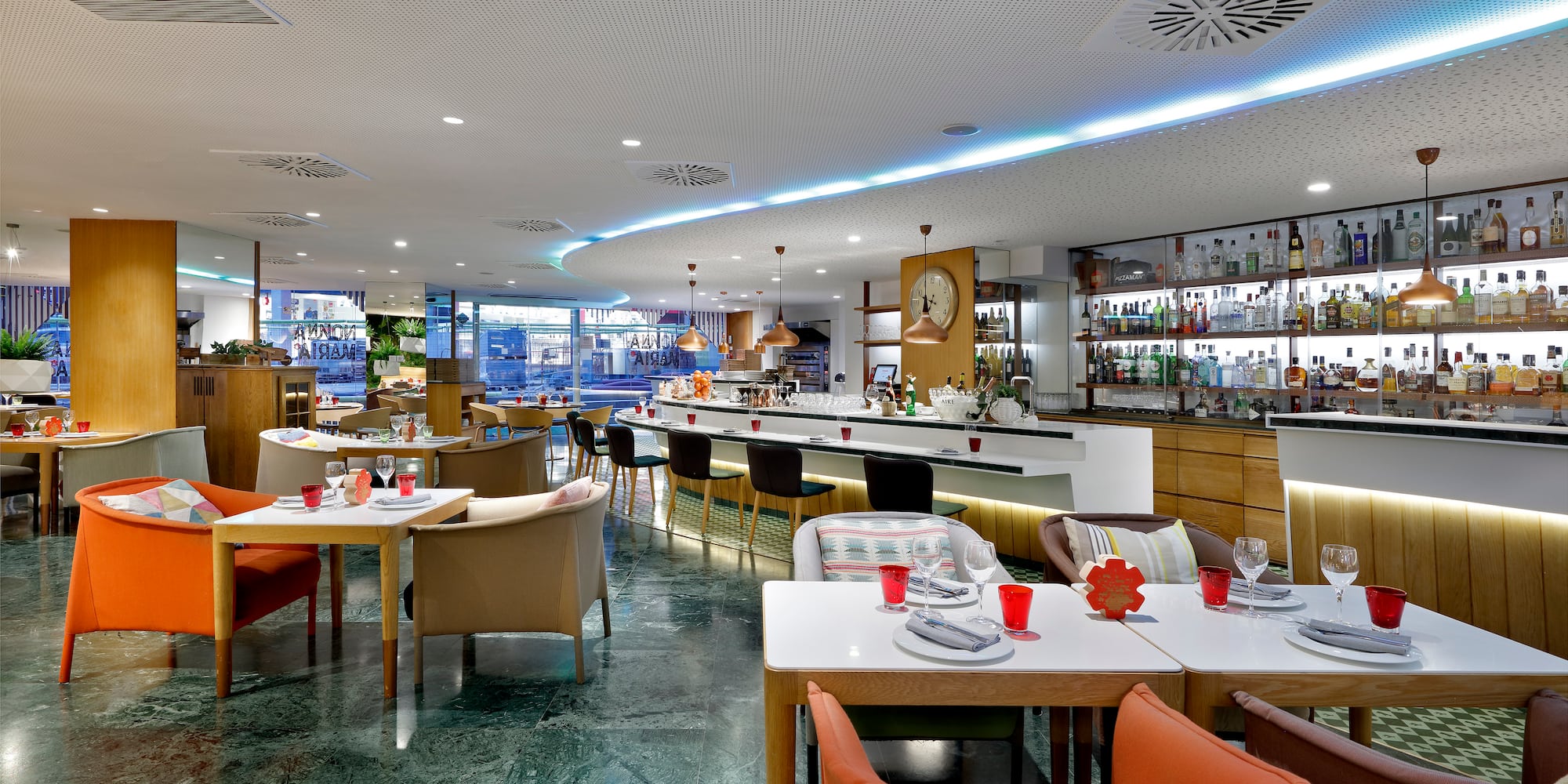 a restaurant with tables and chairs
