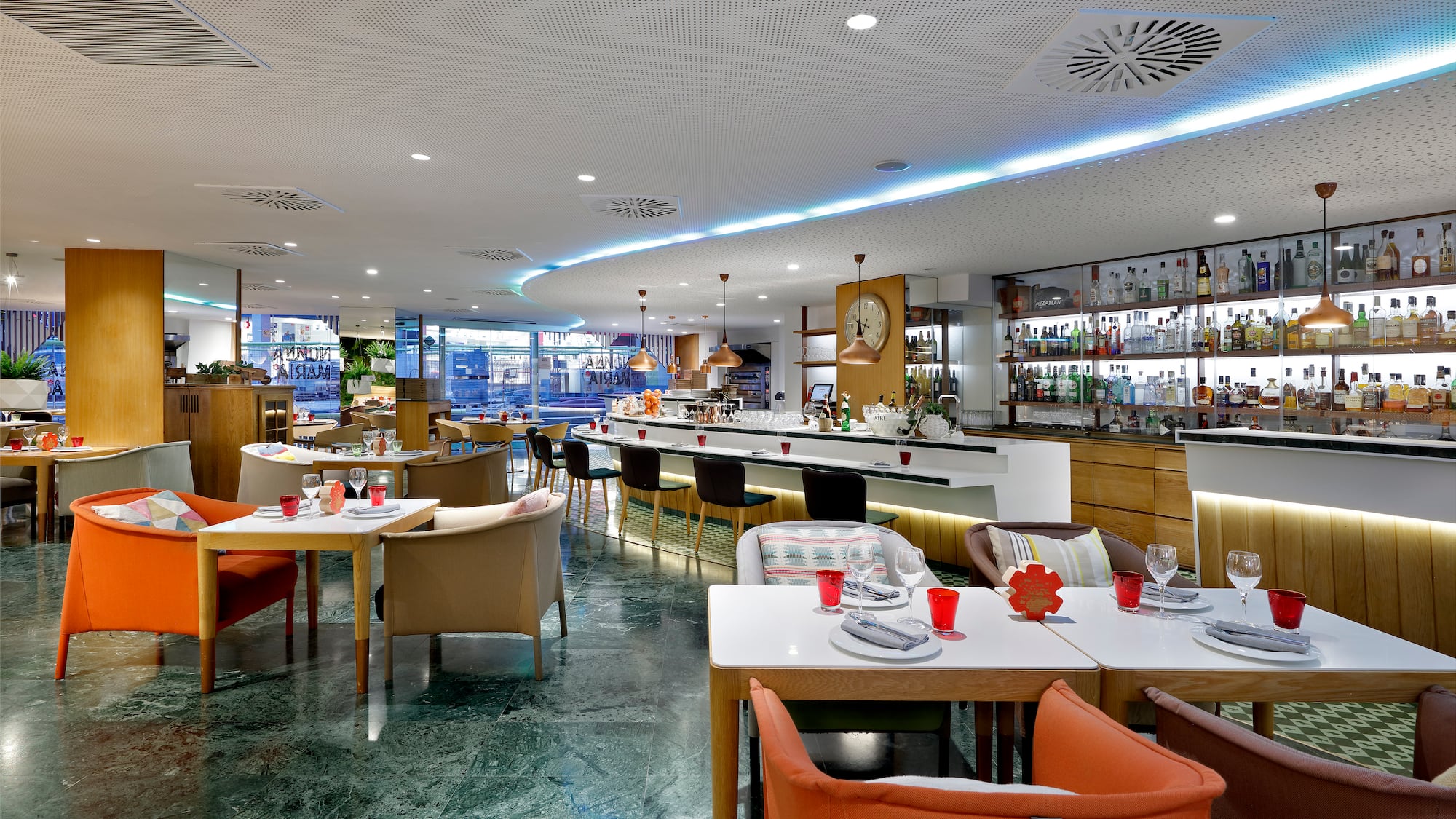 a restaurant with tables and chairs