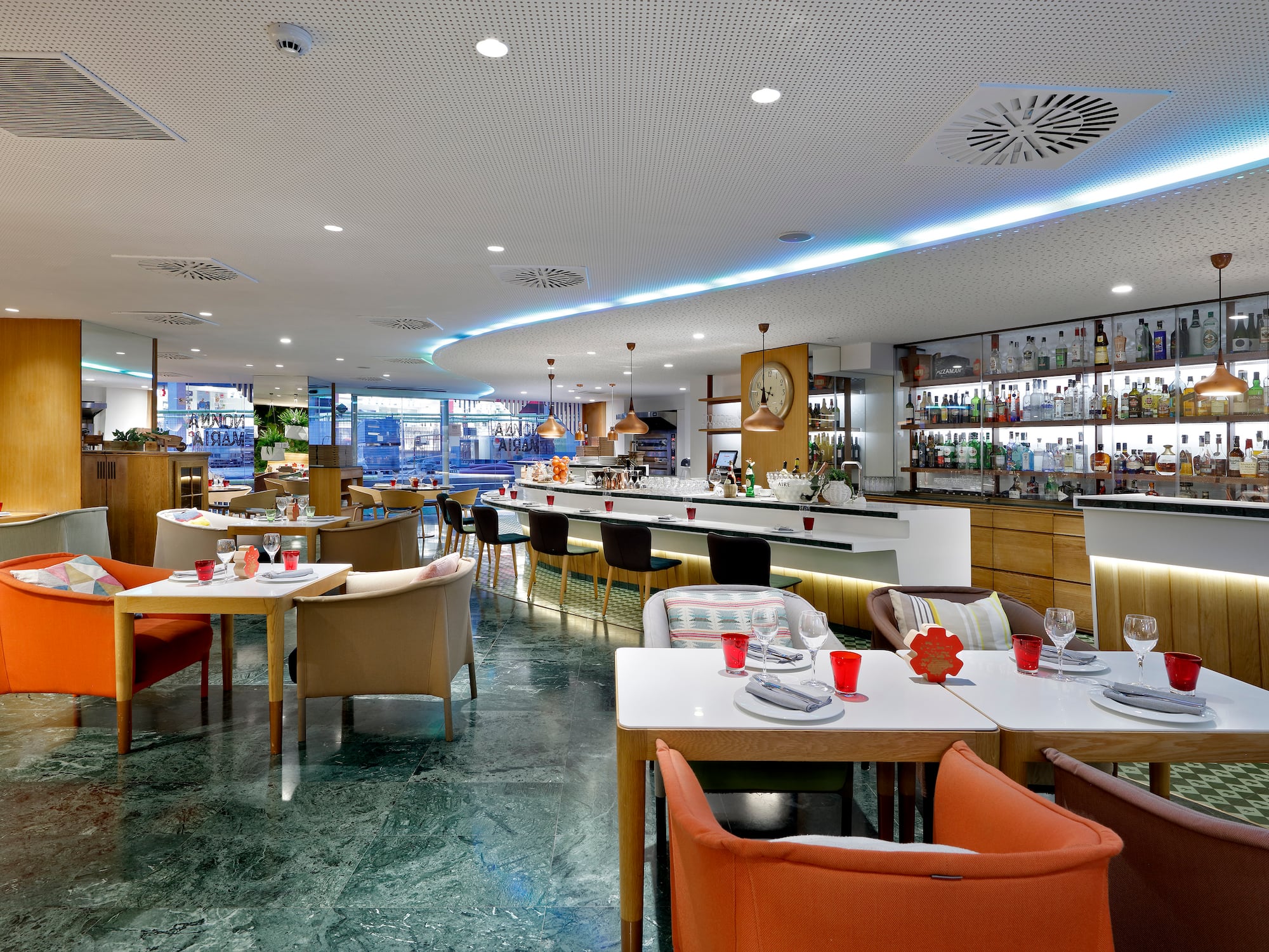 a restaurant with tables and chairs