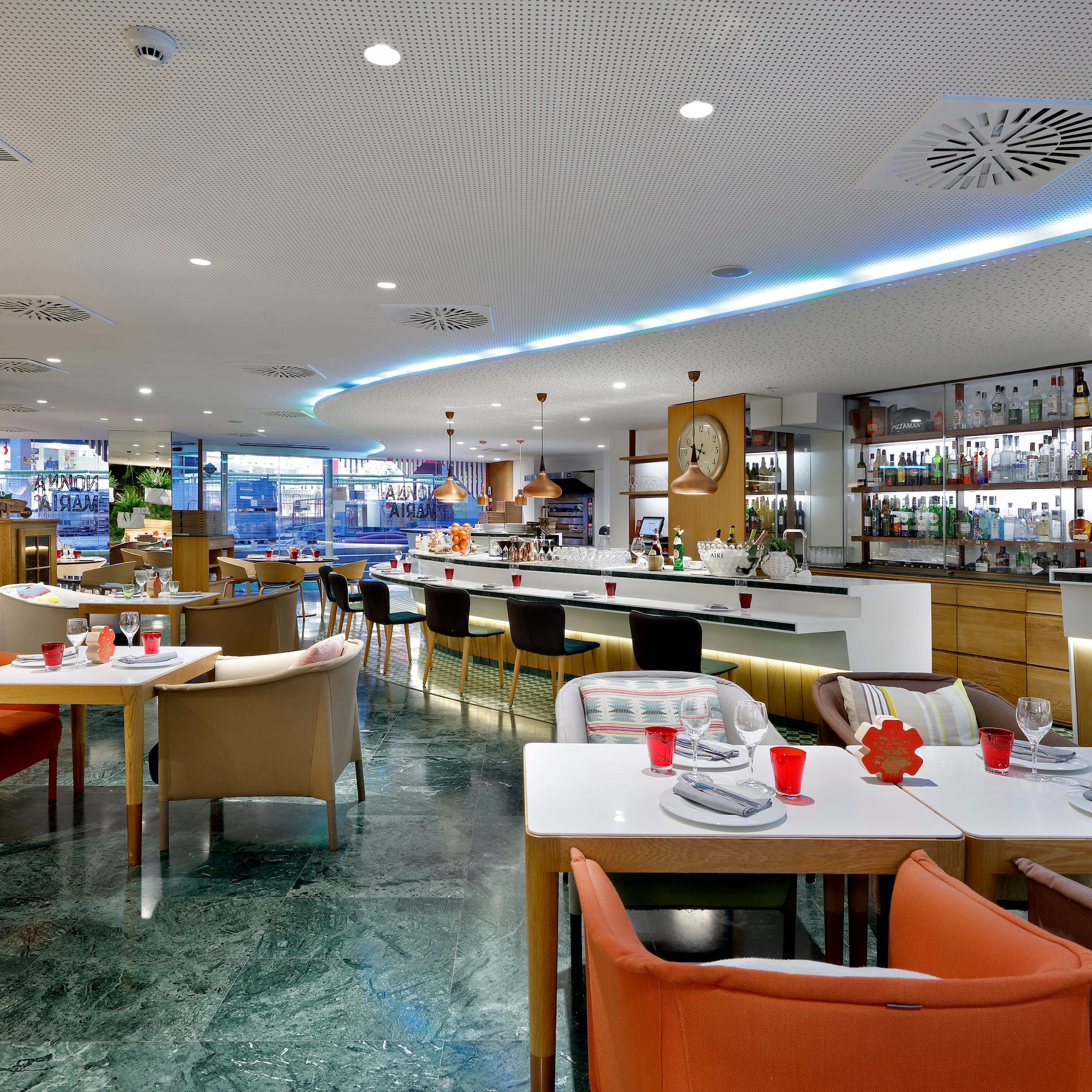 a restaurant with tables and chairs
