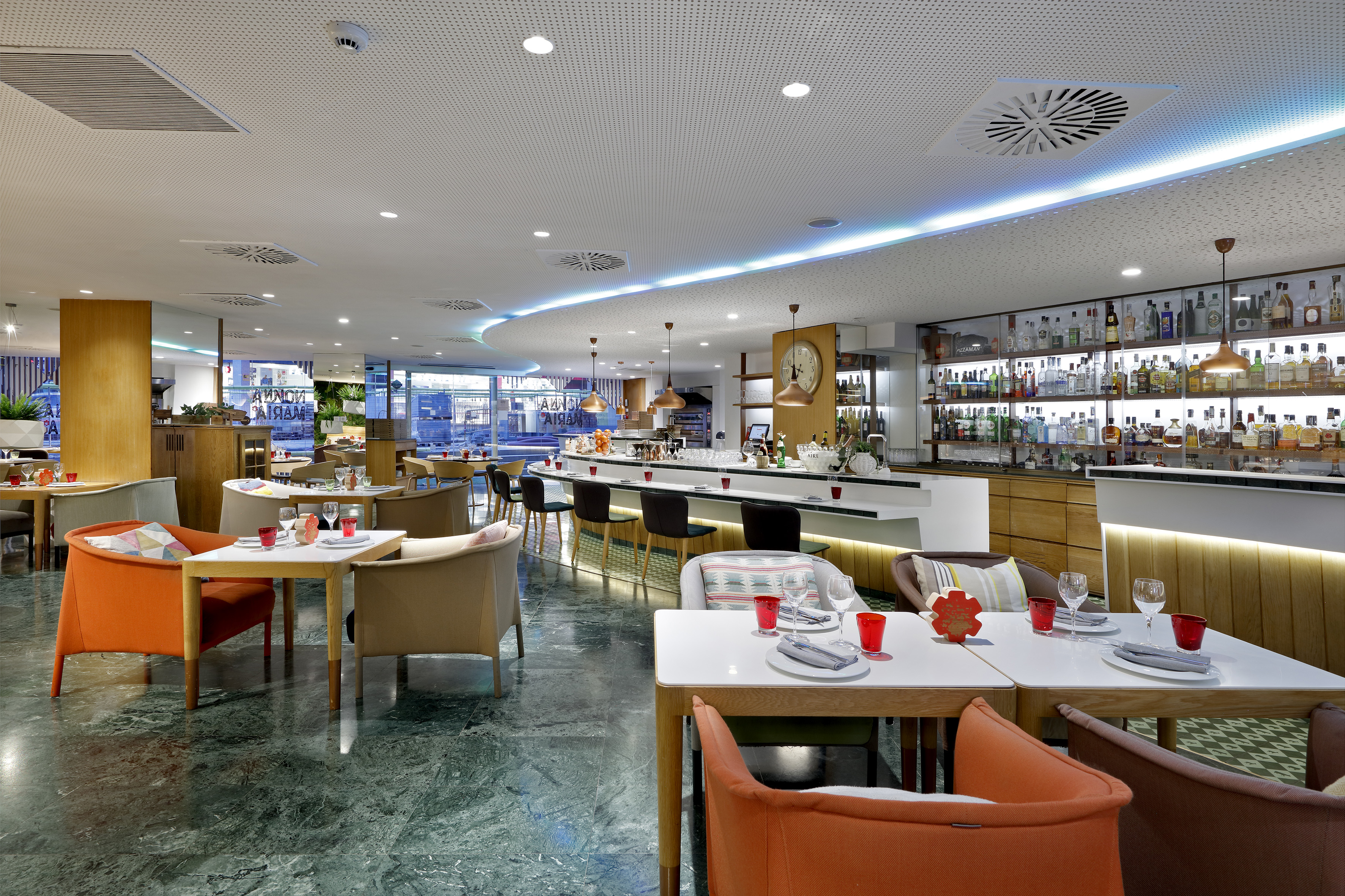 a restaurant with tables and chairs