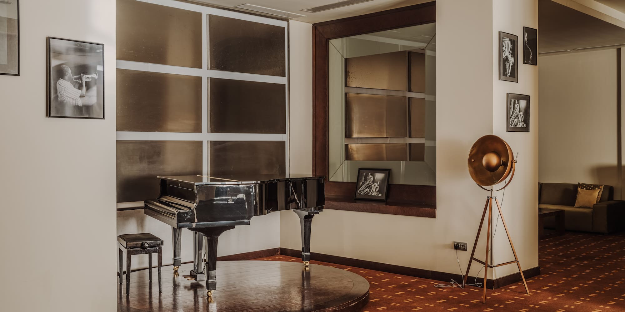 a piano on a round platform in a room