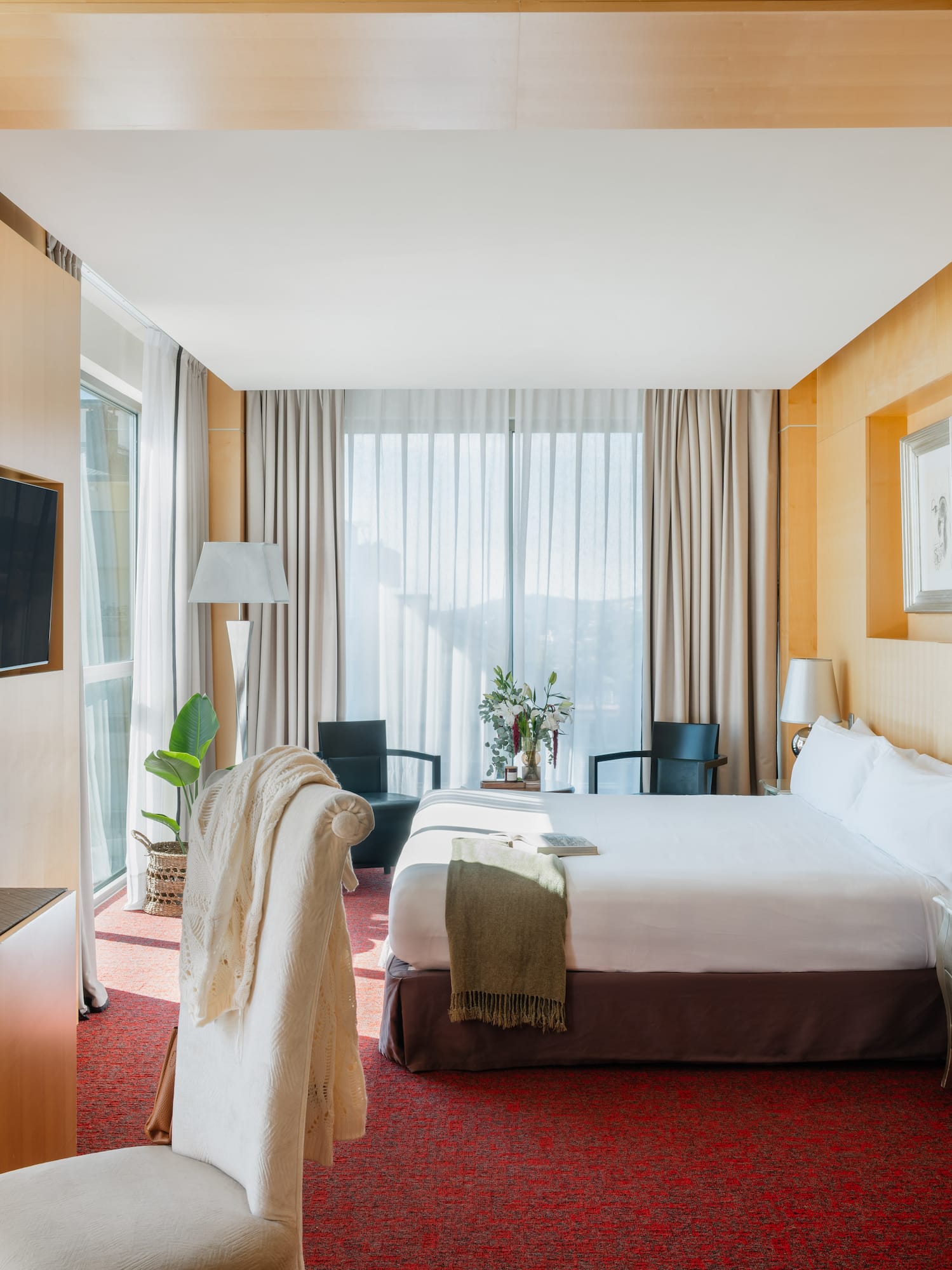 a room with a bed and a tv