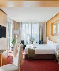 a room with a bed and a tv