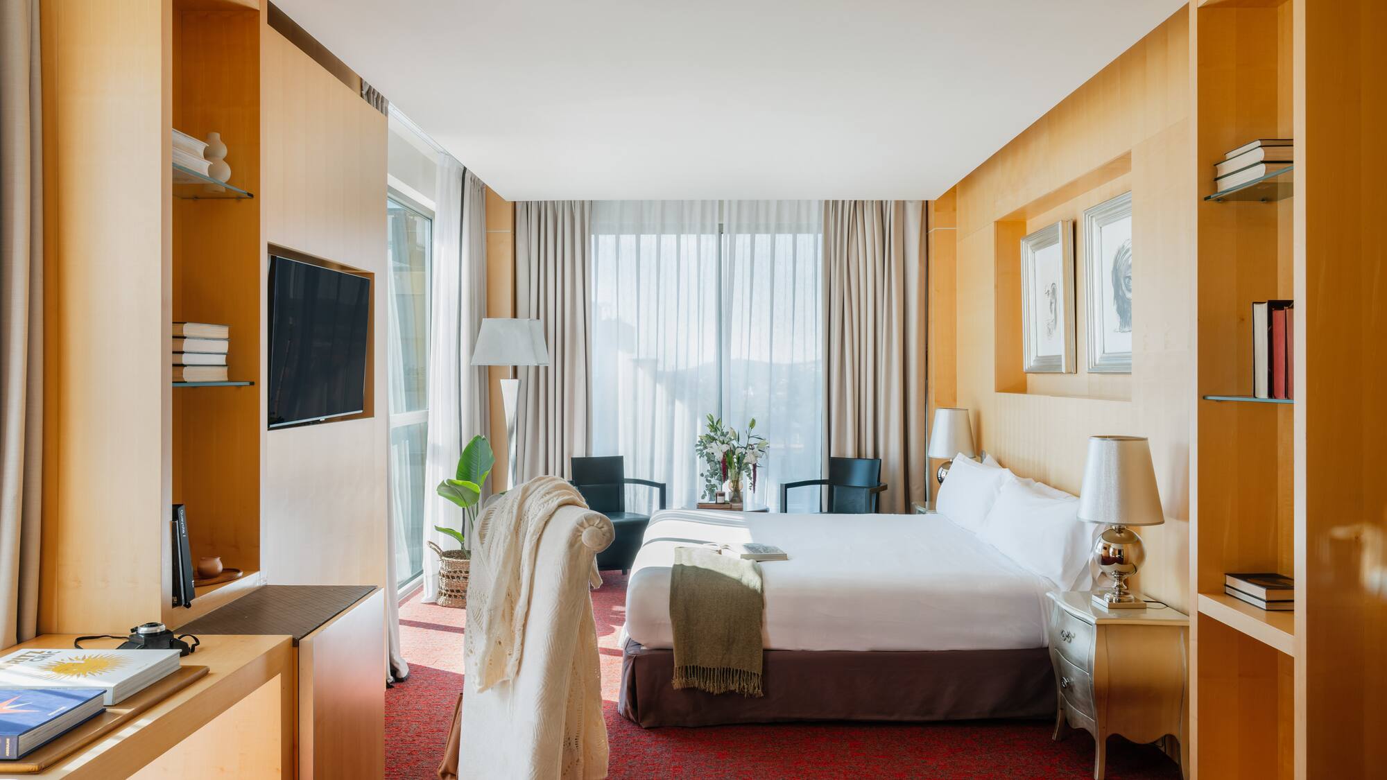 a room with a bed and a tv