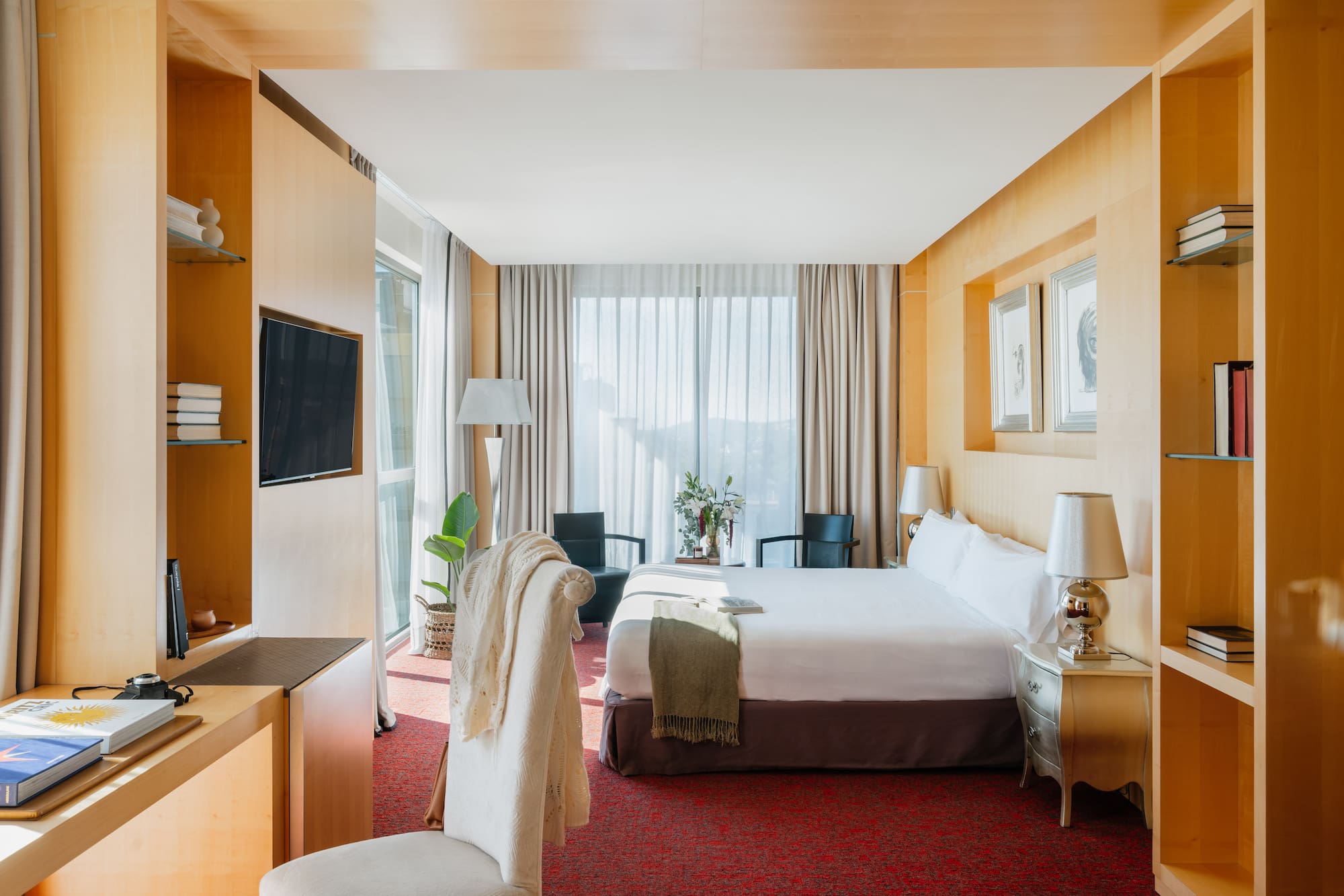 a room with a bed and a tv