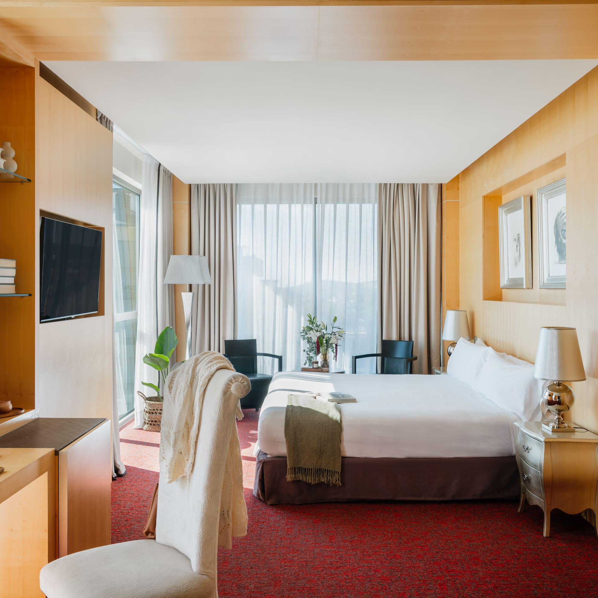 a room with a bed and a tv