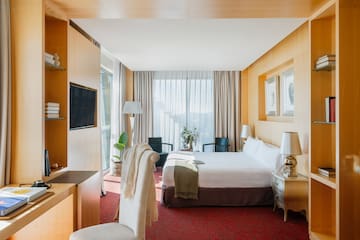 a room with a bed and a tv