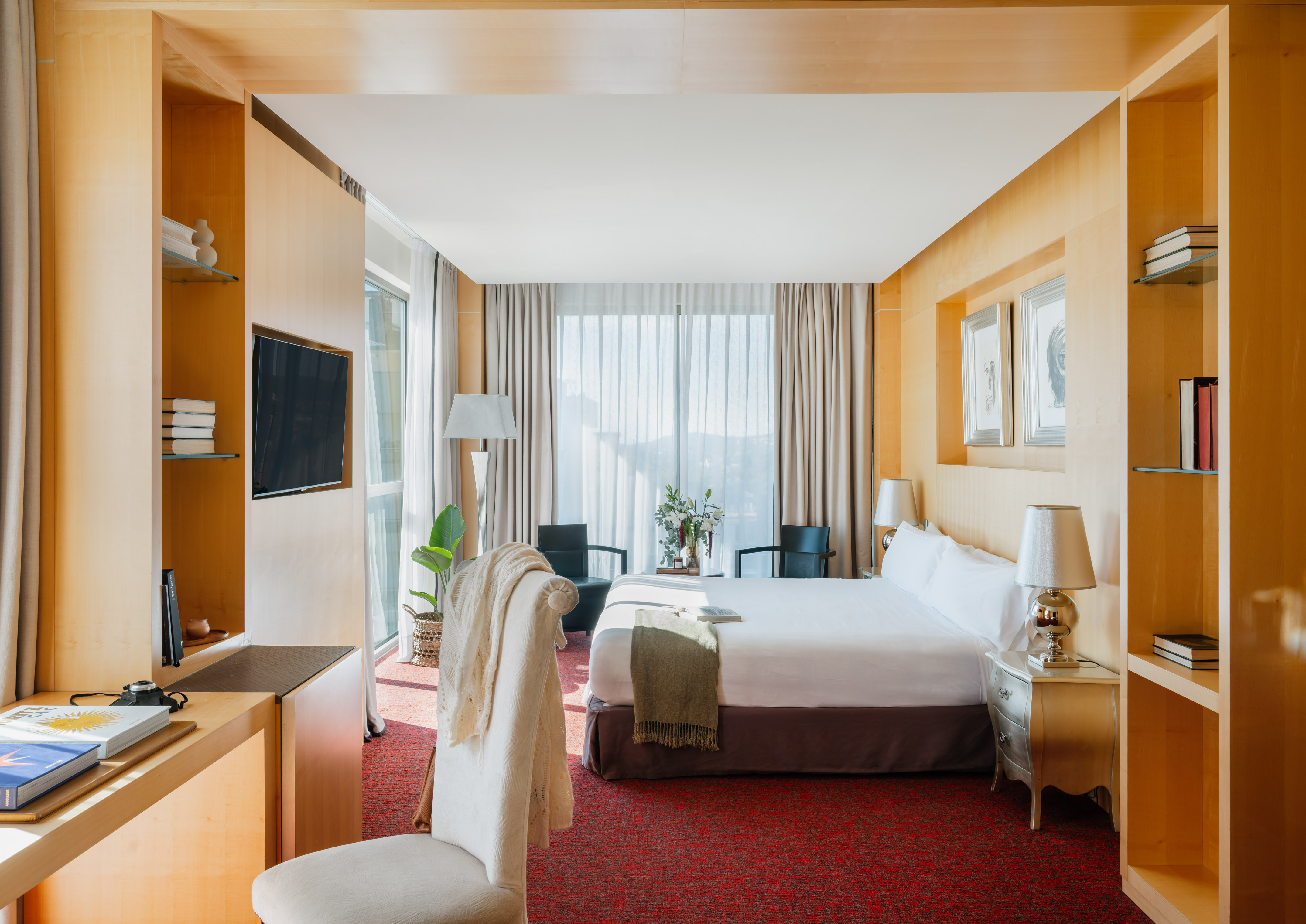 a room with a bed and a tv