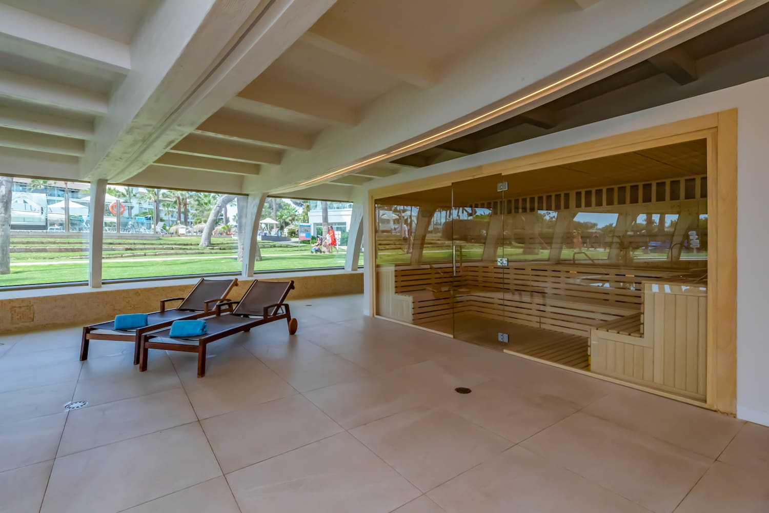 a room with a sauna and chairs